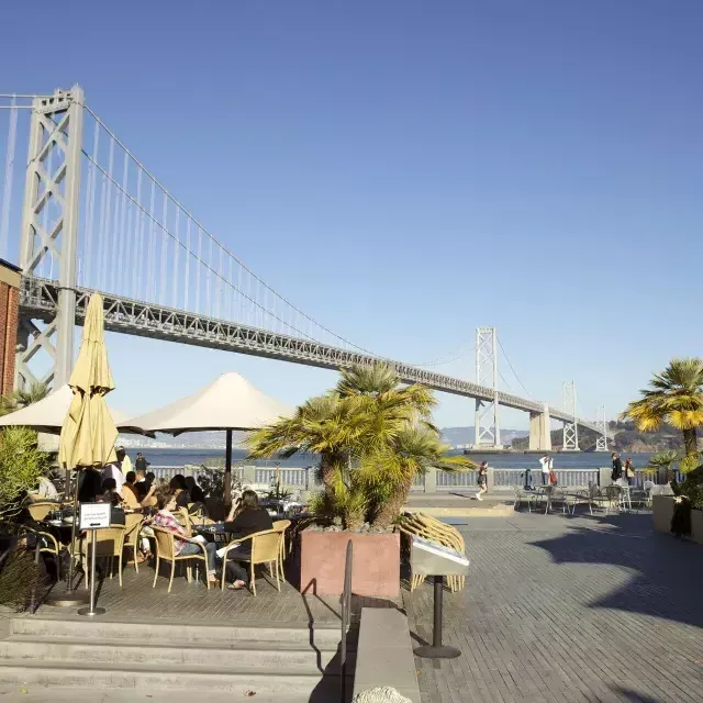 Diners enjoy a meal along the San Francisco waterfront.